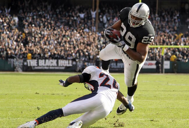 OAKLAND, CA - NOVEMBER 06:  Michael Bush #29 of the Oakland Raiders dives in for a touchdown against the Denver Broncos at O.co Coliseum on November 6, 2011 in Oakland, California.  (Photo by Ezra Shaw/Getty Images)