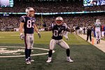 EAST RUTHERFORD, NJ - NOVEMBER 13:   Deion Branch #84 and Wes Welker #83 of the New England Patriots celebrate after a touchdown against the New York Jets at MetLife Stadium on November 13, 2011 in East Rutherford, New Jersey.  (Photo by Chris Trotman/Getty Images)