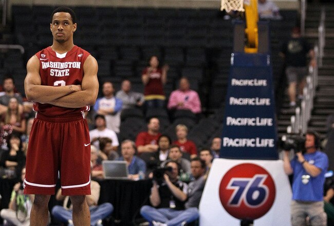 LOS ANGELES, CA - MARCH 10:  Reggie Moore #3 of the Washington State Cougars looks on as the clock shows 00.4 seconds remaining against the Washington Huskies in the quarterfinals of the 2011 Pacific Life Pac-10 Men's Basketball Tournament at Staples Center on March 10, 2011 in Los Angeles, California. The Cougars were defeated 89-87 by the Huskies.  (Photo by Jeff Gross/Getty Images)