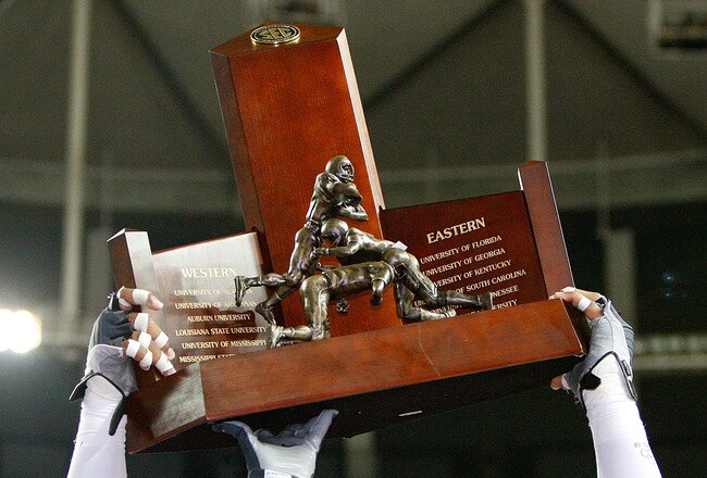 ATLANTA - DECEMBER 05:  Terrence Cody #62 of the Alabama Crimson Tide celebrates with the trophy after their 32-13 win over the Florida Gators in the SEC Championship at Georgia Dome on December 5, 2009 in Atlanta, Georgia.  (Photo by Kevin C. Cox/Getty Images)