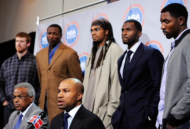 NEW YORK, NY - NOVEMBER 10:  Billy Hunter, Executive Director of the National Basketball Players Association (front L), and Derek Fisher, President of the National Basketball Players Association (front C) speak at a press conference after the NBA and NBA Player's Association met to negotiate the CBA at The Helmsley Hotel on November 10, 2011 in New York City.  (Photo by Patrick McDermott/Getty Images)