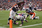 DENVER, CO - OCTOBER 09:  Running back Knowshon Moreno #27 of the Denver Broncos dives over Dante Hughes #33 of the San Diego Chargers for a touchdown at Sports Authority Field at Mile High on October 9, 2011 in Denver, Colorado. The Chargers defeated the Broncos 29-24.  (Photo by Doug Pensinger/Getty Images)