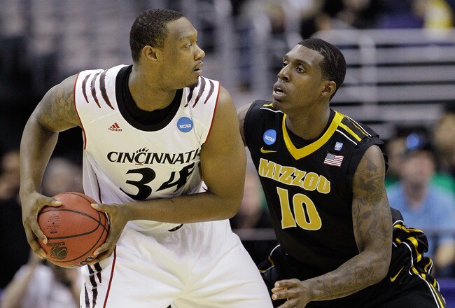 WASHINGTON - MARCH 17:  Ricardo Ratliffe #10 of the Missouri Tigers defends Yancy Gates #34 of the Cincinnati Bearcats during the second round of the 2011 NCAA men's basketball tournament at the Verizon Center on March 17, 2011 in Washington, DC.  (Photo by Rob Carr/Getty Images)