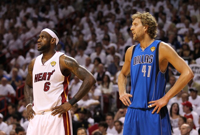 MIAMI, FL - JUNE 12: (L-R) LeBron James #6 of the Miami Heat and Dirk Nowitzki #41 of the Dallas Mavericks look on in Game Six of the 2011 NBA Finals at American Airlines Arena on June 12, 2011 in Miami, Florida. The Mavericks won 105-95. NOTE TO USER: User expressly acknowledges and agrees that, by downloading and/or using this Photograph, user is consenting to the terms and conditions of the Getty Images License Agreement.  (Photo by Mike Ehrmann/Getty Images)
