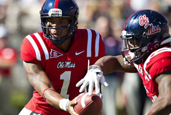 OXFORD,  MS - OCTOBER 22:  Quarterback Randall Mackey #1 of the Ole Miss Rebels makes a hand off during a game against the Arkansas Razorbacks at Vaught-Hemingway Stadium on October 22, 2011 in Oxford, Mississippi.  The Razorbacks defeated the Rebels 29 to 24.  (Photo by Wesley Hitt/Getty Images)