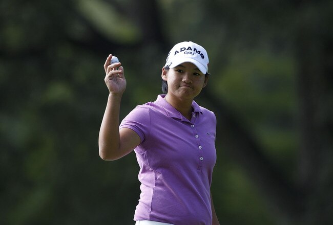 GUADALAJARA, MEXICO - NOVEMBER 11:  Yani Tseng of Taiwan acknowledges the gallery during the second round of the Lorena Ochoa Invitational Presented by Banamex and Jalisco It Happens Within You held at Guadalajara Country Club on November 11, 2011 in Guadalajara, Mexico.  (Photo by Michael Cohen/Getty Images)