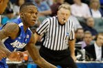 TULSA, OK - MARCH 18:  Joe Jackson #1 of the Memphis Tigers drives with the ball against Lamont Jones #12 of the Arizona Wildcats during the second round game of the 2011 NCAA men's basketball tournament at BOK Center on March 18, 2011 in Tulsa, Oklahoma.  (Photo by Tom Pennington/Getty Images)