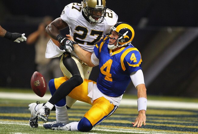 ST. LOUIS, MO - OCTOBER 30: A.J. Feeley #4 of the St. Louis Rams fumbles the ball after being sacked by Malcolm Jenkins #27 of the New Orleans Saints at the Edward Jones Dome on October 30, 2011 in St. Louis, Missouri.  The Rams beat the Saints 31-21.  (Photo by Dilip Vishwanat/Getty Images)