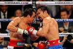 LAS VEGAS, NV - NOVEMBER 12:  Juan Manuel Marquez (L) and Manny Pacquiao battle in the 10th round of their WBO world welterweight title fight at the MGM Grand Garden Arena November 12, 2011 in Las Vegas, Nevada. Pacquiao retained his title with a majority decision victory.  (Photo by Ethan Miller/Getty Images)