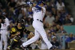 LOS ANGELES, CA - SEPTEMBER 16:  James Loney #7 of the Los Angeles Dodgers hits a pich hit three run home run in the sixth inning against the Pittsburgh Pirates on September 16, 2011 at Dodger Stadium in Los Angeles, California.   (Photo by Stephen Dunn/Getty Images)