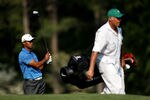 AUGUSTA, GA - APRIL 09:  Tiger Woods watches his shot as caddie Steve Williams walks by during the third round of the 2011 Masters Tournament at Augusta National Golf Club on April 9, 2011 in Augusta, Georgia.  (Photo by Andrew Redington/Getty Images)