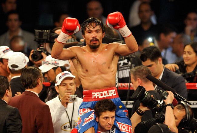 LAS VEGAS, NV - NOVEMBER 12:  Manny Pacquiao celebrates his majority decision victory against Juan Manuel Marquez in the WBO world welterweight title fight at the MGM Grand Garden Arena on November 12, 2011 in Las Vegas, Nevada.  (Photo by Ethan Miller/Getty Images)