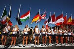 MELBOURNE, AUSTRALIA - MARCH 16:  Grid girls hold the national flags of all of drivers nationalities before the Australian Formula One Grand Prix at the Albert Park Circuit on March 16, 2008 in Melbourne, Australia.  (Photo by Mark Thompson/Getty Images)