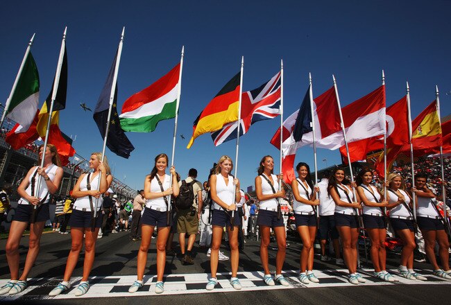 MELBOURNE, AUSTRALIA - MARCH 16:  Grid girls hold the national flags of all of drivers nationalities before the Australian Formula One Grand Prix at the Albert Park Circuit on March 16, 2008 in Melbourne, Australia.  (Photo by Mark Thompson/Getty Images)