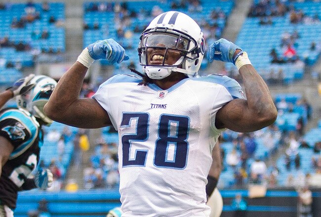 CHARLOTTE, NC - NOVEMBER 13: Tennessee Titans running back Chris Johnson #28 flexes his muscles after scoring a touchdown against the Carolina Panthers at Bank of America Stadium on November 13, 2011 in Charlotte, North Carolina.  The Titans defeated the Panthers 30-3.  (Photo by Brian A. Westerholt/Getty Images)