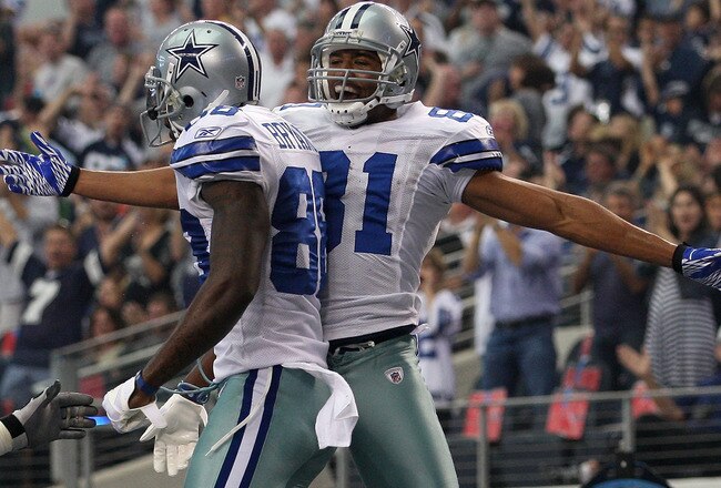 ARLINGTON, TX - NOVEMBER 13:  Laurent Robinson #81 of the Dallas Cowboys celebrates his touchdown with Dez Bryant #88 against the Buffalo Bills at Cowboys Stadium on November 13, 2011 in Arlington, Texas.  (Photo by Ronald Martinez/Getty Images)