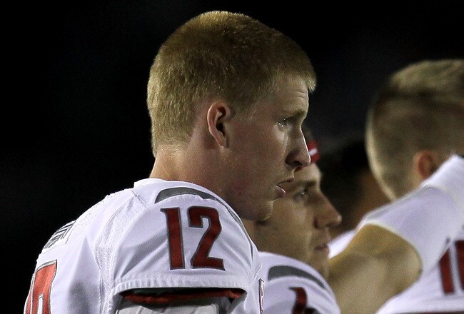 PASADENA, CA - OCTOBER 08:  Backup quarterbacks Connor Halliday #12, David Gilbertson #4, and Jeff Tuel #10 of the Washington State Cougars signal in a play against the UCLA Bruins at the Rose Bowl on October 8, 2011 in Pasadena, California.  UCLA won 28-25.  (Photo by Stephen Dunn/Getty Images)