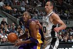 SAN ANTONIO - MARCH 24:  Guard Kobe Bryant #24 of the Los Angeles Lakers dribbles the ball past Manu Ginobili #20 of the San Antonio Spurs at AT&T Center on March 24, 2010 in San Antonio, Texas.  NOTE TO USER: User expressly acknowledges and agrees that, by downloading and/or using this Photograph, user is consenting to the terms and conditions of the Getty Images License Agreement.  (Photo by Ronald Martinez/Getty Images)