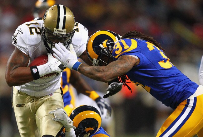ST. LOUIS, MO - OCTOBER 30: Marques Colston #12 of the New Orleans Saints catches a pass against Al Harris #31 of the St. Louis Rams at the Edward Jones Dome on October 30, 2011 in St. Louis, Missouri.  The Rams beat the Saints 31-21.  (Photo by Dilip Vishwanat/Getty Images)