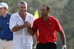 AUGUSTA, GA - APRIL 10:  Tiger Woods of the USA and his caddie Steve Williams on the 18th green during the final round of the 2011 Masters Tournament at Augusta National Golf Club on April 10, 2011 in Augusta, Georgia.  (Photo by Ross Kinnaird/Getty Images for Golf Week)