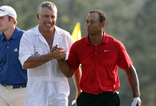AUGUSTA, GA - APRIL 10:  Tiger Woods of the USA and his caddie Steve Williams on the 18th green during the final round of the 2011 Masters Tournament at Augusta National Golf Club on April 10, 2011 in Augusta, Georgia.  (Photo by Ross Kinnaird/Getty Images for Golf Week)
