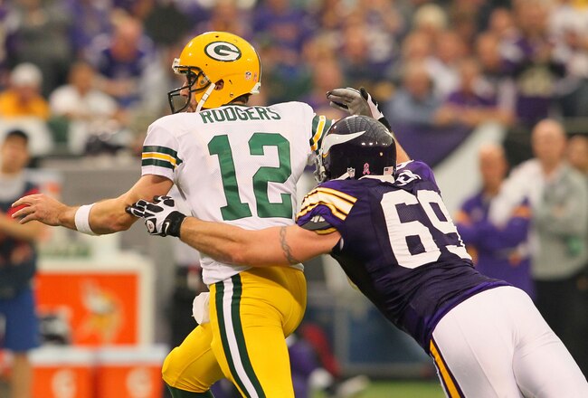 MINNEAPOLIS, MN - OCTOBER 23:  Jared Allen #69 of the Minnesota Vikings sacks Aaron Rodgers #12 of the Green Bay Packers at the Hubert H. Humphrey Metrodome on October 23, 2011 in Minneapolis, Minnesota.  (Photo by Adam Bettcher /Getty Images)