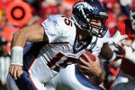 KANSAS CITY, MO - NOVEMBER 13:  Quarterback Tim Tebow #15 of the Denver Broncos rushes to the outside against the Kansas City Chiefs on November 13, 2011 during the first half at Arrowhead Stadium in Kansas City, Missouri.  (Photo by Peter Aiken/Getty Images)