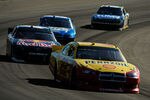 AVONDALE, AZ - NOVEMBER 13:  Kevin Harvick, driver of the #29 Budweiser Chevrolet, leads a line of cars during the NASCAR Sprint Cup Series Kobalt Tools 500 at Phoenix International Raceway on November 13, 2011 in Avondale, Arizona.  (Photo by Rainier Ehrhardt/Getty Images for NASCAR)
