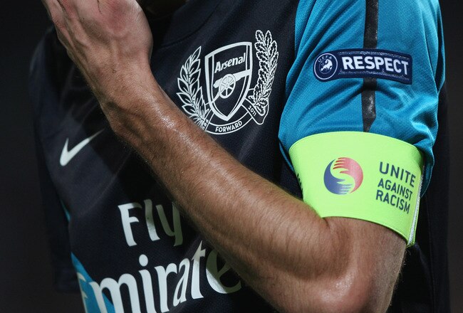 MARSEILLE, FRANCE - OCTOBER 19:  Arsenal captain Robin van Persie wears the UEFA 'Unite Against Racism' armband during the UEFA Champions League Group F match between Olympique de Marseille and Arsenal FC at Stade Velodrome on October 19, 2011 in Marseille, France.  (Photo by Michael Steele/Getty Images)