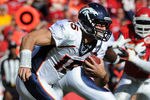 KANSAS CITY, MO - NOVEMBER 13:  Quarterback Tim Tebow #15 of the Denver Broncos rushes to the outside against the Kansas City Chiefs on November 13, 2011 during the first half at Arrowhead Stadium in Kansas City, Missouri.  (Photo by Peter Aiken/Getty Images)