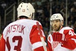 SAN JOSE, CA - MAY 01:  Henrik Zetterberg #40 and Pavel Datsyuk #13 of the Detroit Red Wings celebrate after Henrik Zetterberg scored a goal against the San Jose Sharks in Game Two of the Western Conference Semifinals during the 2011 NHL Stanley Cup Playoffs at HP Pavilion on May 1, 2011 in San Jose, California.  (Photo by Ezra Shaw/Getty Images)