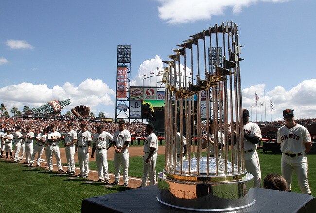 SAN FRANCISCO, CA - APRIL 08:  The 2010 World Series trophy is displayed as San Francisco Giants players line up before the start of the Giants' opening day game against the St. Louis Cardinals at AT&T Park on April 8, 2011 in San Francisco, California.  (Photo by Marcio Jose Sanchez-Pool/Getty Images)