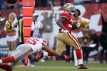 SAN FRANCISCO, CA - NOVEMBER 13:  Kendall Hunter #32 of the San Francisco 49ers runs past Spencer Paysinger #55 of the New York Giants for a touchdown at Candlestick Park on November 13, 2011 in San Francisco, California.  (Photo by Ezra Shaw/Getty Images)