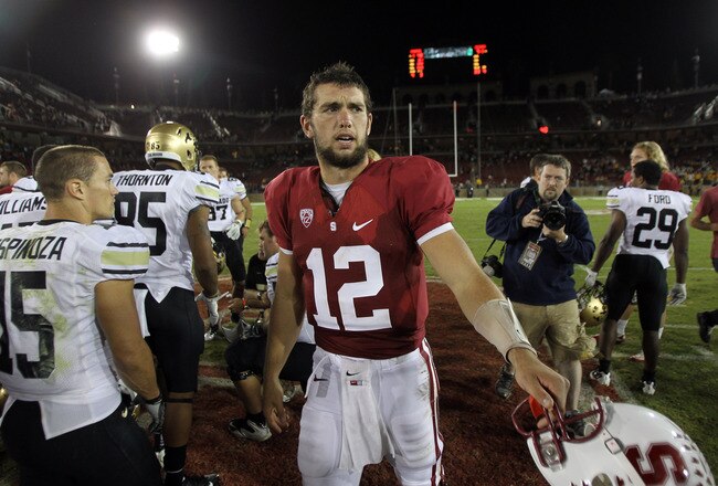 STANFORD, CA - OCTOBER 08:  Andrew Luck #12 of the Stanford Cardinal shakes hands with players from the Colorado Buffaloes after their game at Stanford Stadium on October 8, 2011 in Stanford, California.  (Photo by Ezra Shaw/Getty Images)