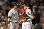 BOSTON, MA - AUGUST 30:  Francisco Cervelli #17 of the New York Yankees reacts after he is hit by a pitch as catcher Jarrod Saltalamacchia #39 of the Boston Red Sox and home plate umpire Ed Rapuano try to calm Cervelli down on August 30, 2011 at Fenway Park in Boston, Massachusetts.  (Photo by Elsa/Getty Images)