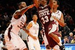 NEW YORK, NY - NOVEMBER 17:  Deville Smith #33 of the Mississippi State Bulldogs drives the ball against Kourtney Roberson #32 of the Texas A&M Aggies during the 2K Sports Classic Benefiting Coaches Vs Cancer at Madison Square Garden on November 17, 2011 in New York City.  (Photo by Patrick McDermott/Getty Images)