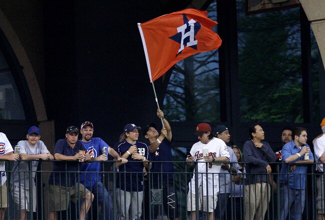 HOUSTON - APRIL 12:  Fans wave an Astros flag in center field at Minute Maid Park on April 12, 2011 in Houston, Texas.  (Photo by Bob Levey/Getty Images)