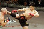 In his MMA debut, Cung Le (right) knocks out Mike Altman with a first-round kick during the 'StrikeForce' professional mixed martial arts event March 10, 2006 at HP Pavilion in San Jose, California USA. (Photo by John Medina/Getty Images)