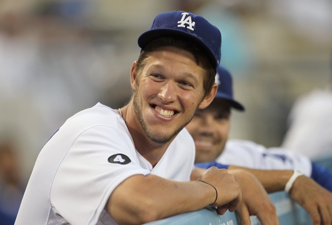 LOS ANGELES, CA - APRIL 01:  Clayton Kershaw #22 of the Los Angeles Dodgers looks on from the dugout against the San Francisco Giants at Dodger Stadium on April 1, 2011 in Los Angeles, California.  (Photo by Jeff Gross/Getty Images)
