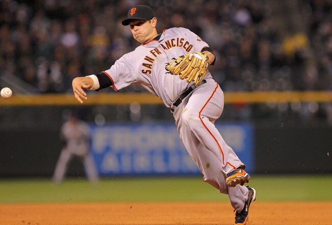 DENVER, CO - APRIL 18:  Second baseman Freddy Sanchez #21 of the San Francisco Giants throws out a runner against the Colorado Rockies at Coors Field on April 18, 2011 in Denver, Colorado.  (Photo by Doug Pensinger/Getty Images)
