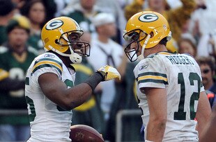 SAN DIEGO, CA - NOVEMBER 06:   Greg Jennings #85 of the Green Bay Packers celebrates his touchdown catch with Aaron Rodgers #12 for a 44-24 lead over the San Diego Chargers during the fourth quarter at Qualcomm Stadium on November 6, 2011 in San Diego, California.  (Photo by Harry How/Getty Images)