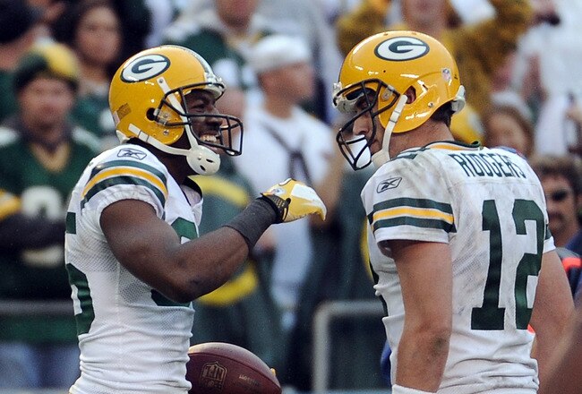 SAN DIEGO, CA - NOVEMBER 06:   Greg Jennings #85 of the Green Bay Packers celebrates his touchdown catch with Aaron Rodgers #12 for a 44-24 lead over the San Diego Chargers during the fourth quarter at Qualcomm Stadium on November 6, 2011 in San Diego, California.  (Photo by Harry How/Getty Images)