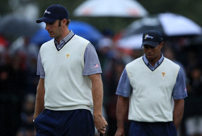MELBOURNE, AUSTRALIA - NOVEMBER 19:  Dustin Johnson of the U.S. Team and Tiger Woods of the U.S. Team walk during the Day Three Afternoon Four-Ball Matches of the 2011 Presidents Cup at Royal Melbourne Golf Course on November 19, 2011 in Melbourne, Australia.  (Photo by Mark Dadswell/Getty Images)