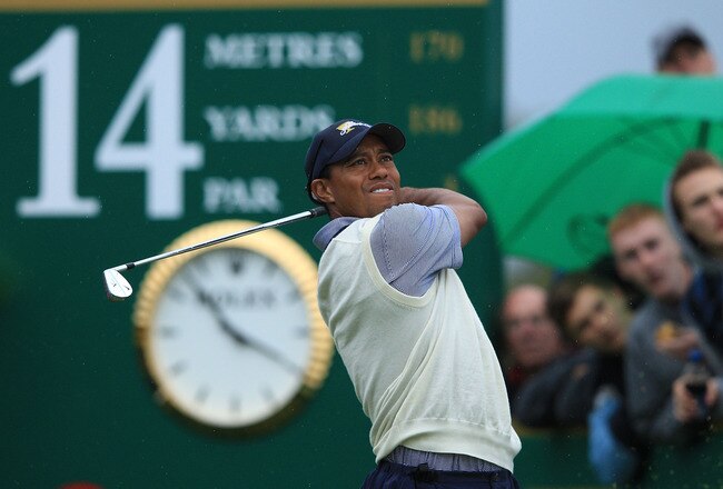 MELBOURNE, AUSTRALIA - NOVEMBER 19:  Tiger Woods of the U.S. Team plays his tee shot on the 14th hole during the Day Three Afternoon Four-Ball Matches of the 2011 Presidents Cup at Royal Melbourne Golf Course on November 19, 2011 in Melbourne, Australia.  (Photo by Mark Dadswell/Getty Images)
