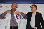 CHICAGO, IL - NOVEMBER 18:  President Theo Epstein of the Chicago Cubs helps new manager Dale Sveum with his jersey during a press conference at Wrigley Field on November 18, 2011 in Chicago, Illinois.  (Photo by Jonathan Daniel/Getty Images)