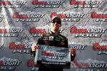 HOMESTEAD, FL - NOVEMBER 19:  Carl Edwards, driver of the #99 Aflac Ford, poses after qualifying for pole position in the NASCAR Sprint Cup Series Ford 400 at Homestead-Miami Speedway on November 19, 2011 in Homestead, Florida.  (Photo by Jonathan Ferrey/Getty Images)