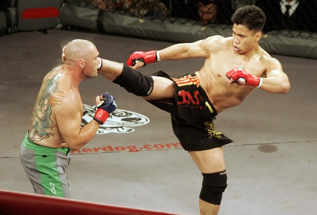 In his MMA debut, Cung Le (right) knocks out Mike Altman with a first-round kick during the 'StrikeForce' professional mixed martial arts event March 10, 2006 at HP Pavilion in San Jose, California USA. (Photo by John Medina/Getty Images)