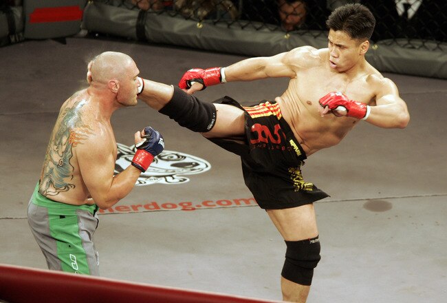 In his MMA debut, Cung Le (right) knocks out Mike Altman with a first-round kick during the 'StrikeForce' professional mixed martial arts event March 10, 2006 at HP Pavilion in San Jose, California USA. (Photo by John Medina/Getty Images)