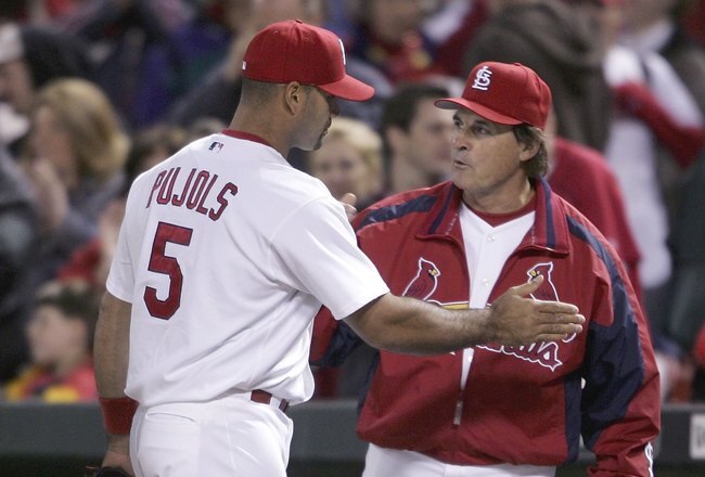 ST. LOUIS - MAY 12:  Manager Tony LaRussa #10 of the St. Louis Cardinals celebrates with Albert Pujols #5 after the game against the Arizona Diamondbacks on May 12, 2006 at Busch Stadium in St. Louis, Missouri. The Cardinals defeated the D-Backs 5-3.  (Photo by Elsa/Getty Images)