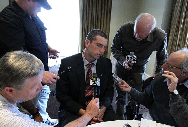 SAN FRANCISCO, CA - AUGUST 01:  Stanford quarterback Andrew Luck (C) talks with reporters during the Bay Area college football media day at the Hotel Nikko on August 1, 2011 in San Francisco, California.  Players and coaches from Stanford, Cal and San Jose State football programs met with reporters ahead of the new season during Bay Area college football media day.  (Photo by Justin Sullivan/Getty Images)
